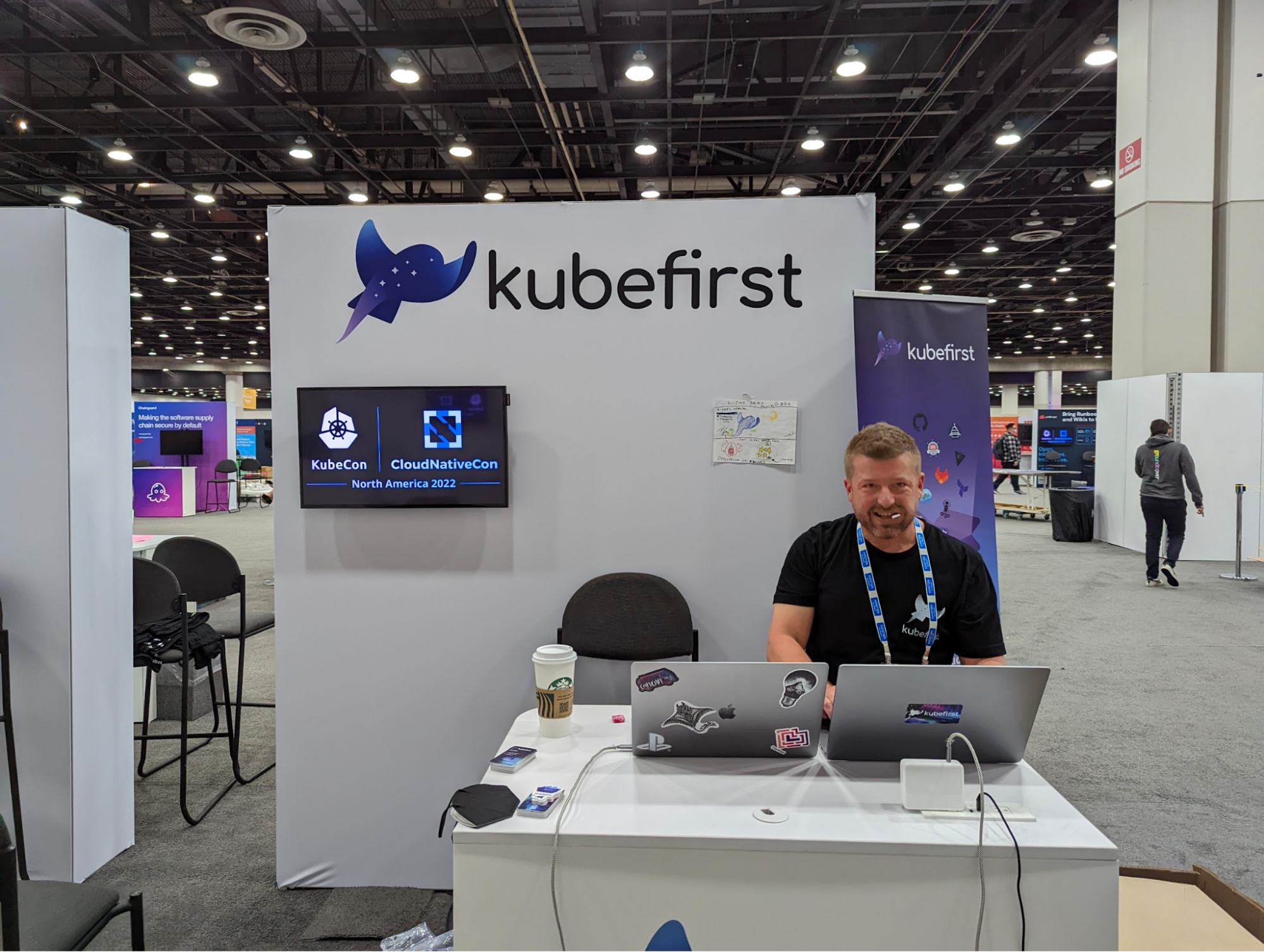 John in front of last year's KubeCon North American booth.